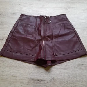 FALDA/PANTALÓN POLIPIEL GRANATE