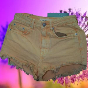 PANTALÓN CORTO MUJER VAQUERO NARANJA
