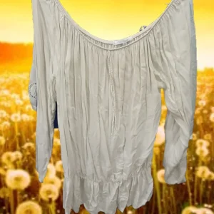 BLUSA LARGA BEIGE DE MANGA LARGA