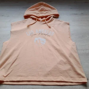 SUDADERA CON CAPUCHA SIN MANGAS Y DIBUJO